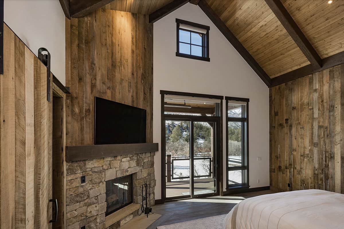 rustic bedroom with a fireplace
