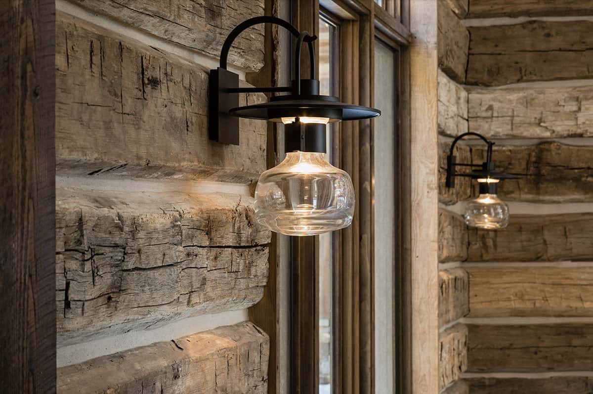 rustic hallway with a wal sconce