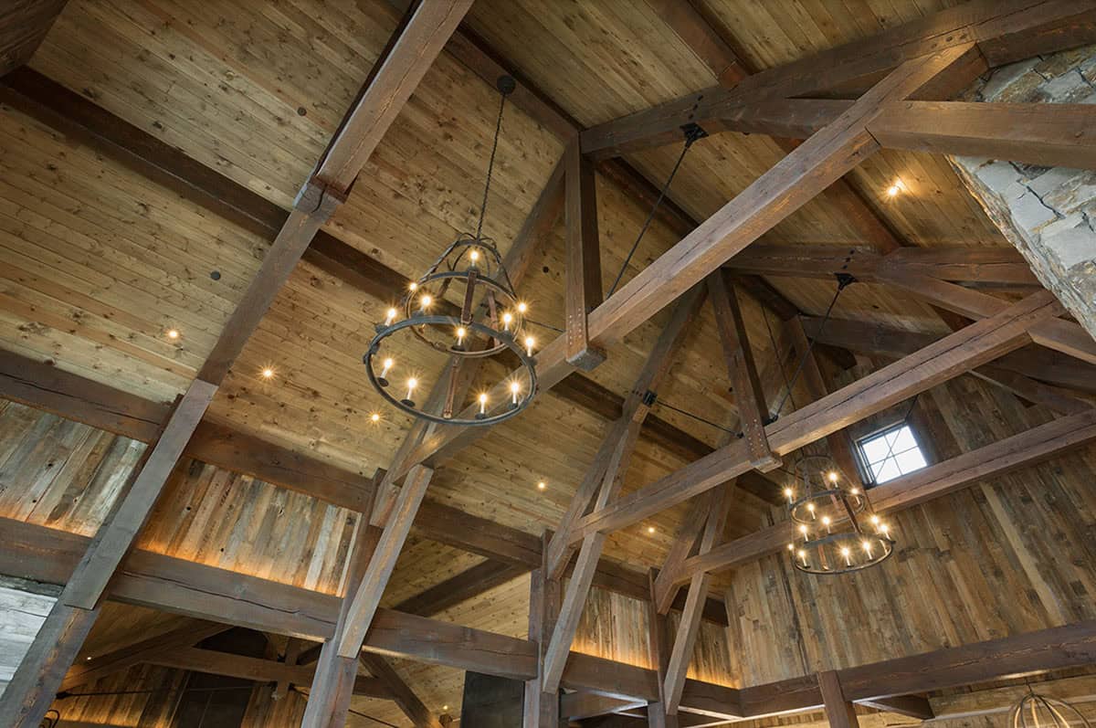 rustic living room ceiling detail with chandeliers