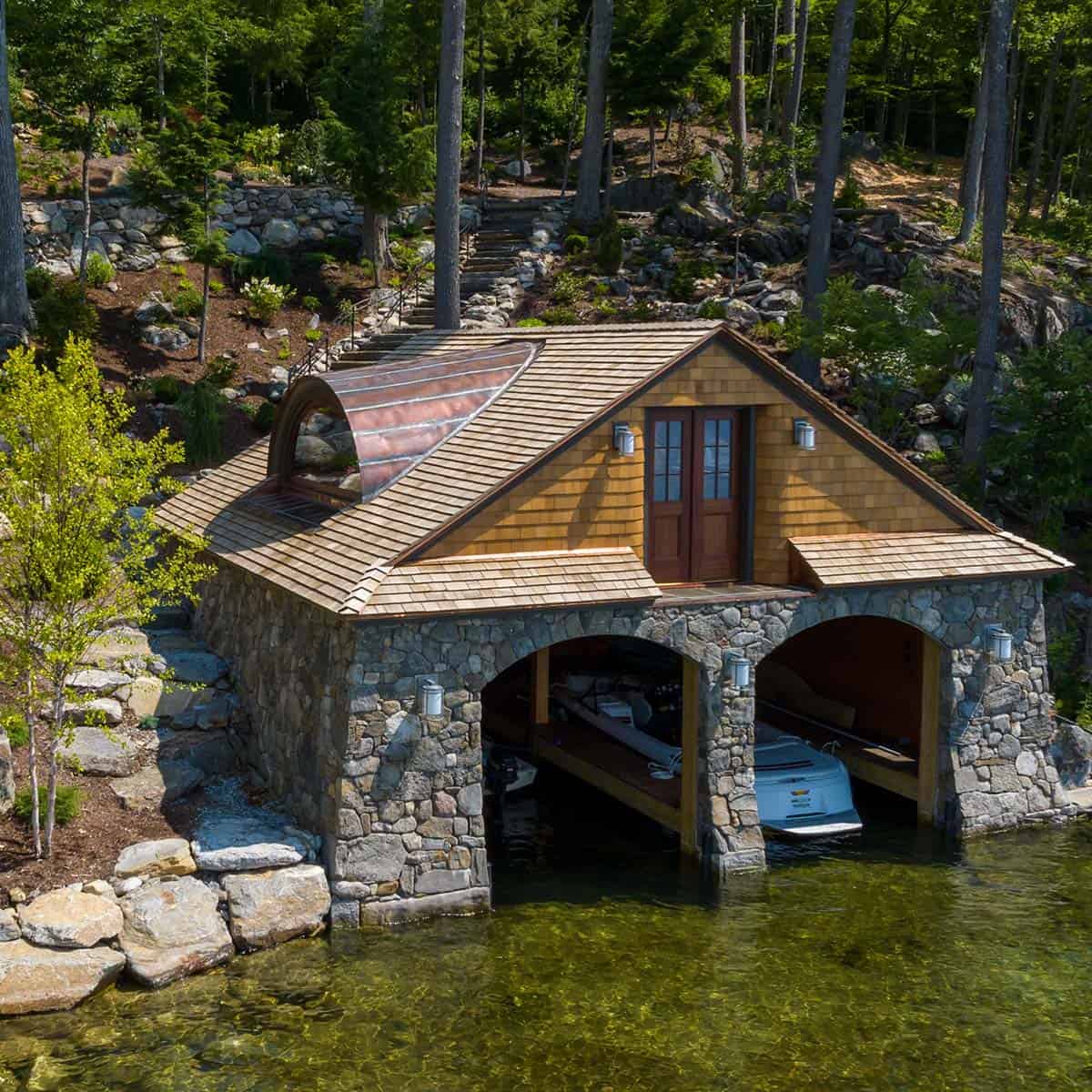 traditiional lake house exterior boat house