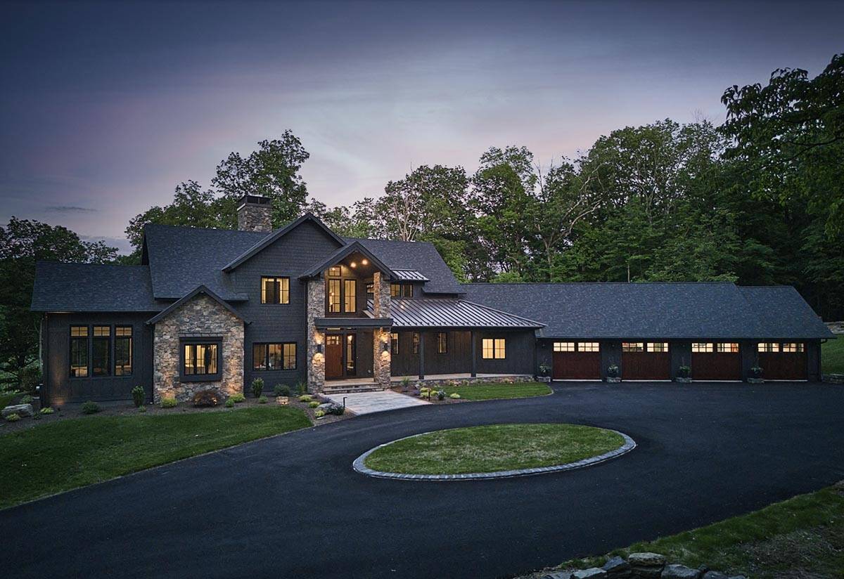 rustic modern house exterior at dusk