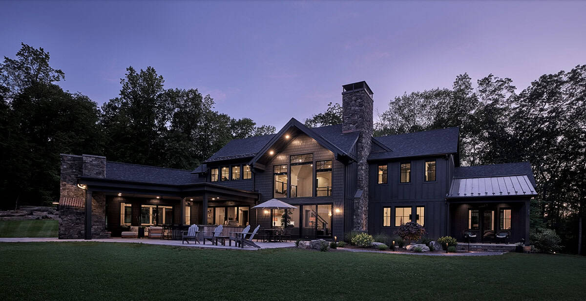 rustic modern house exterior at dusk