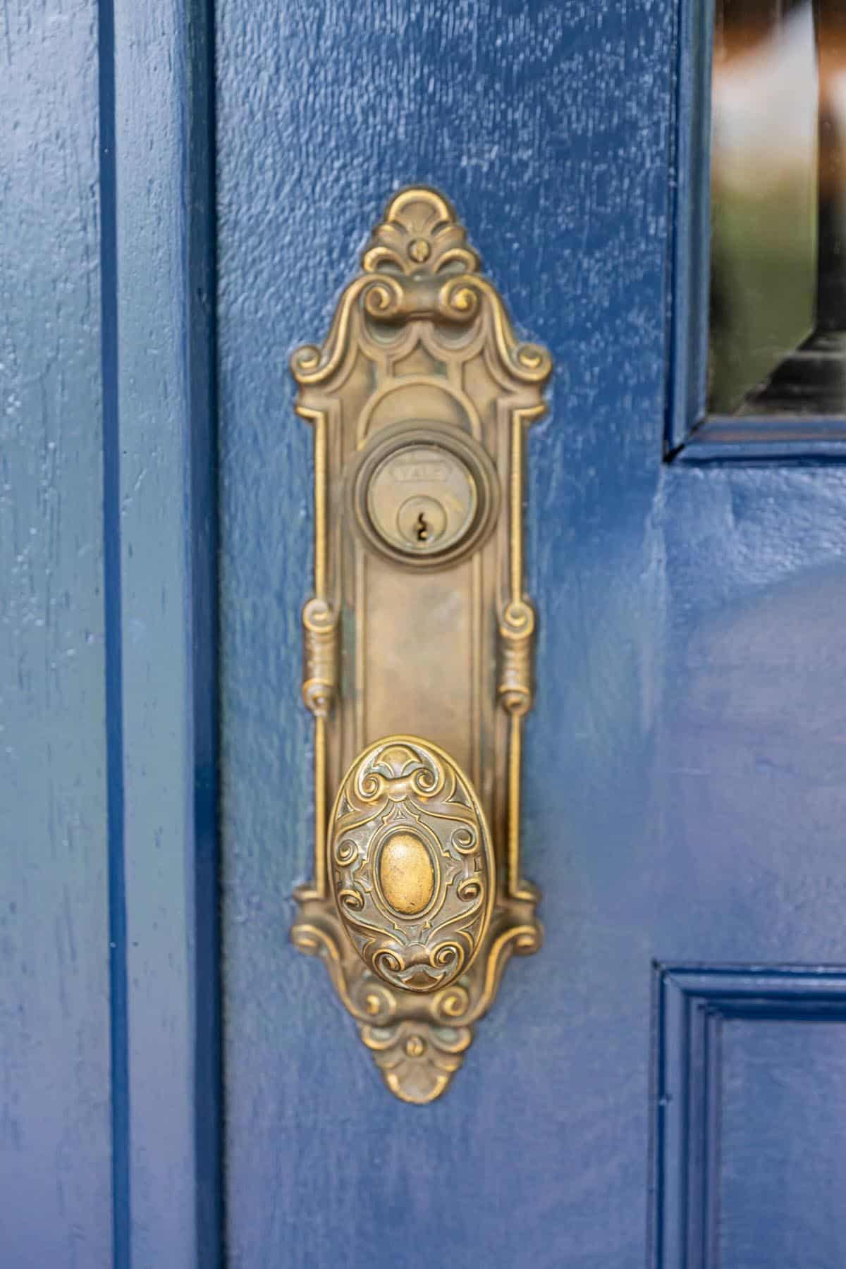alpine farmhouse exterior entry with blue front door detail