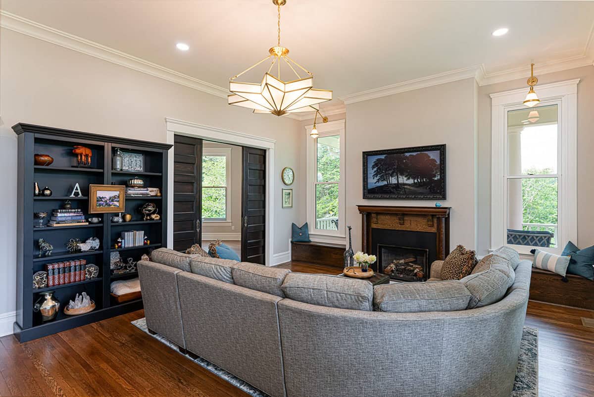 farmhouse style living room with a fireplace