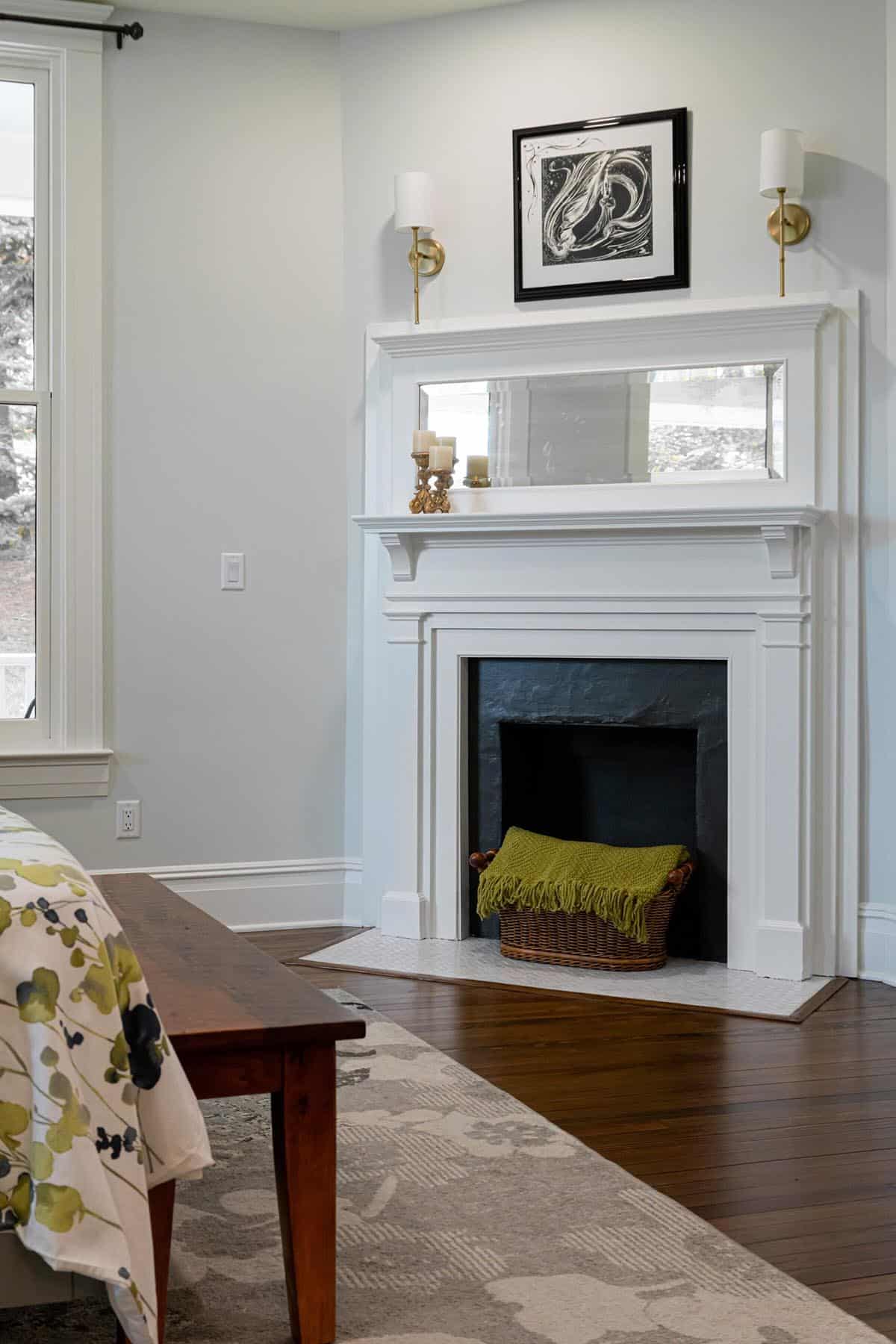 farmhouse style bedroom with a fireplace