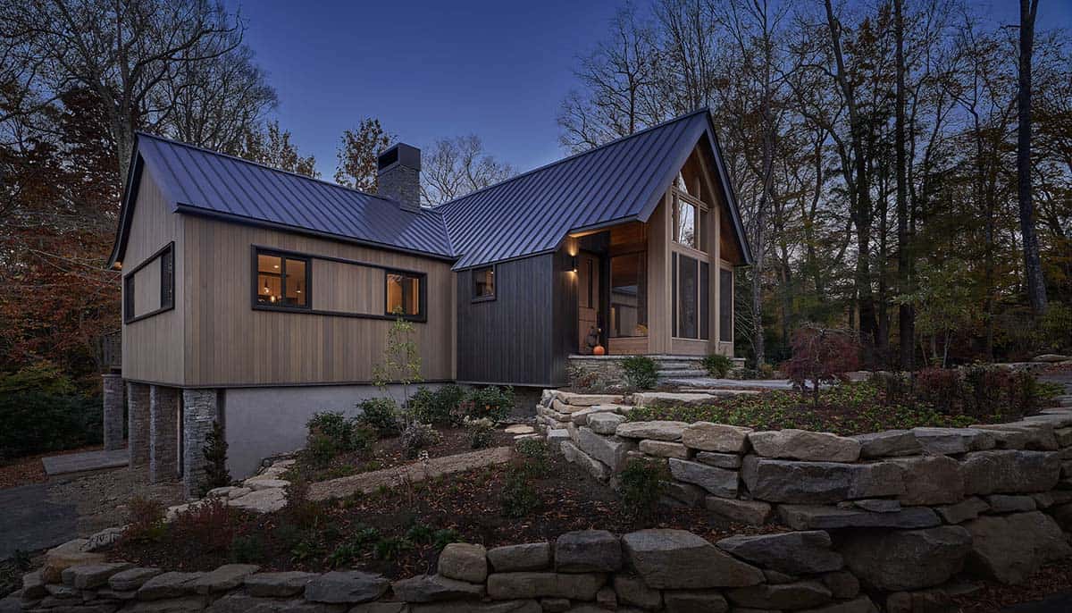 rustic modern mountain home exterior at dusk