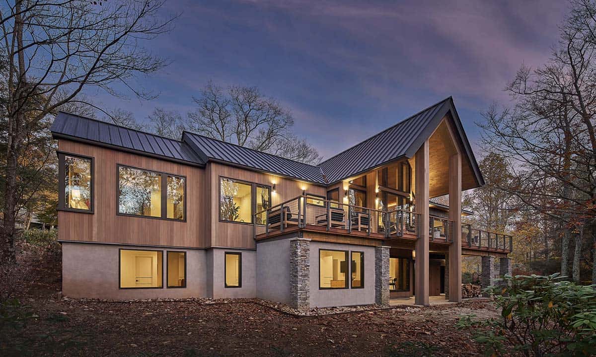 rustic modern mountain home exterior at dusk