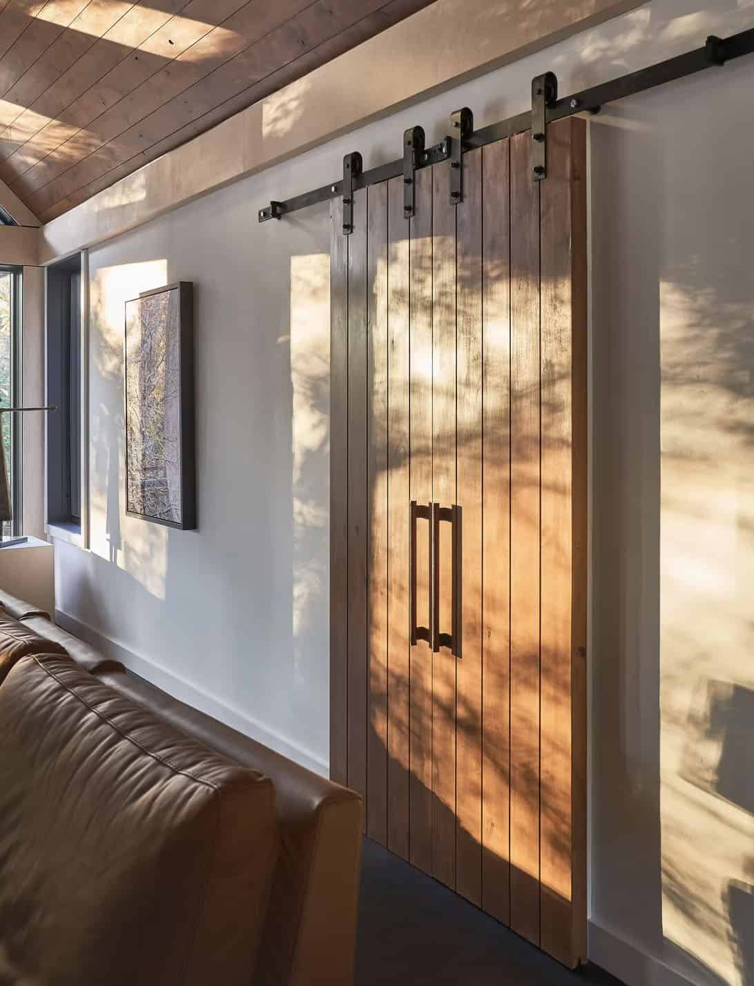 rustic modern living room with a sliding barn door