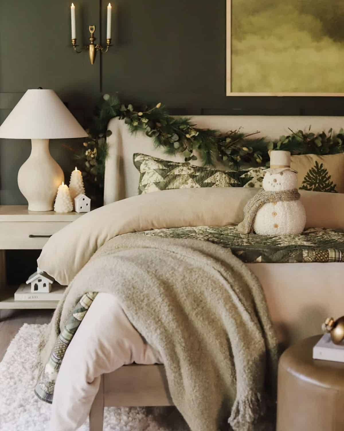 cozy christmas bedroom decor with layers of bedding and garland