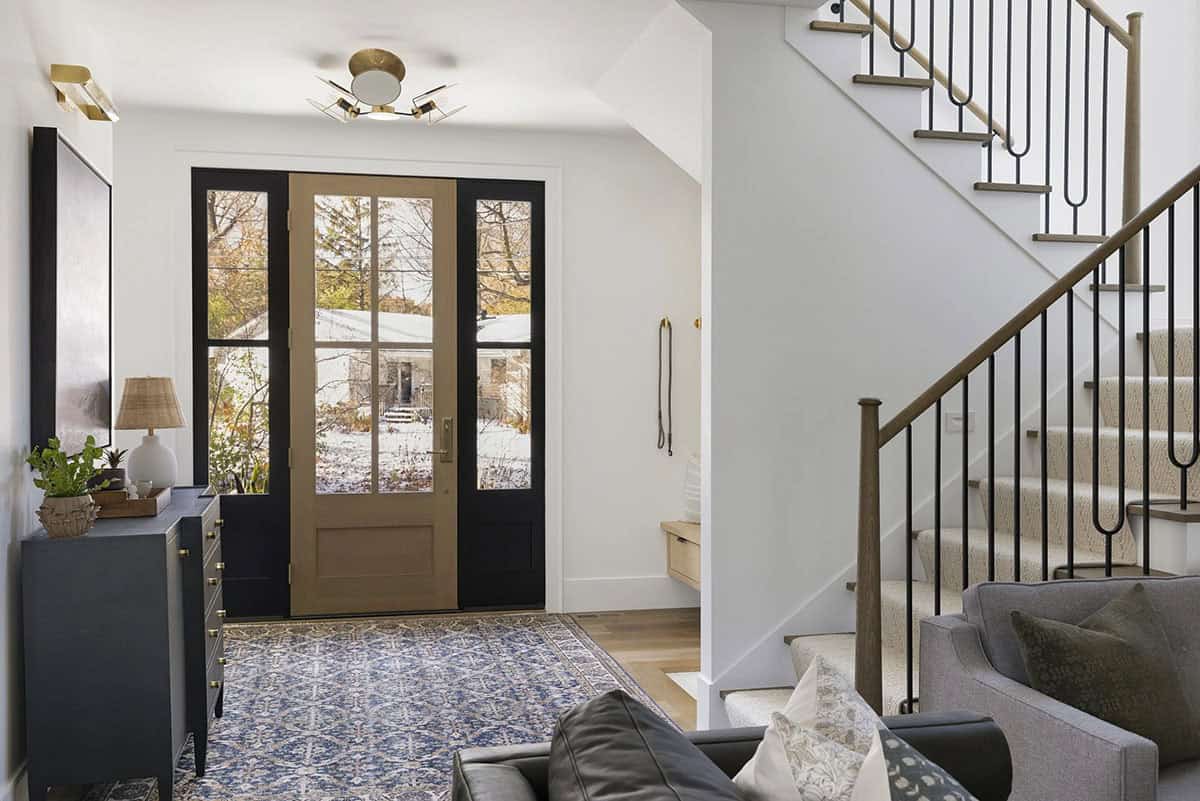 contemporary lake house entry with a staircase