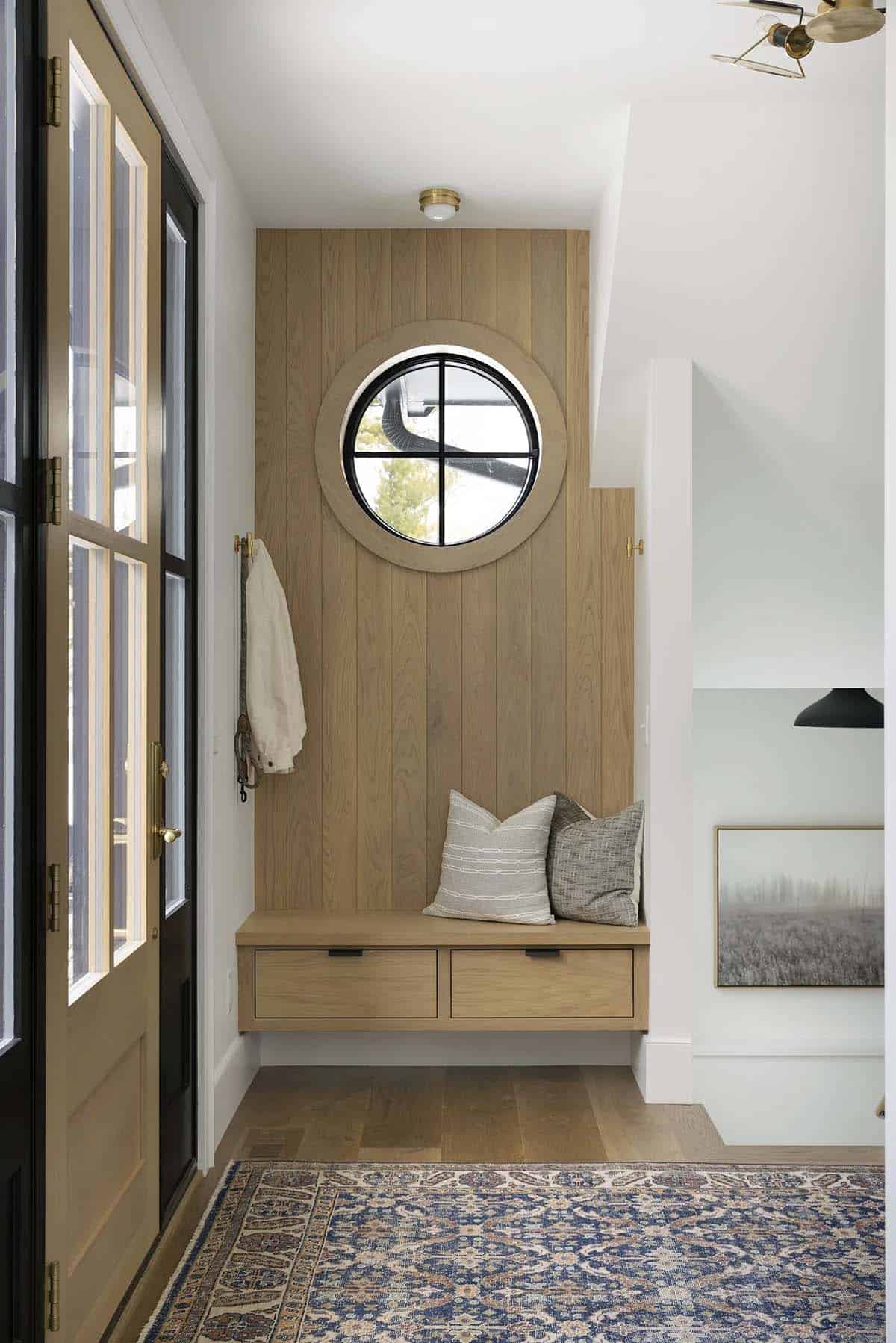 contemporary lake house entry with a built-in bench seat