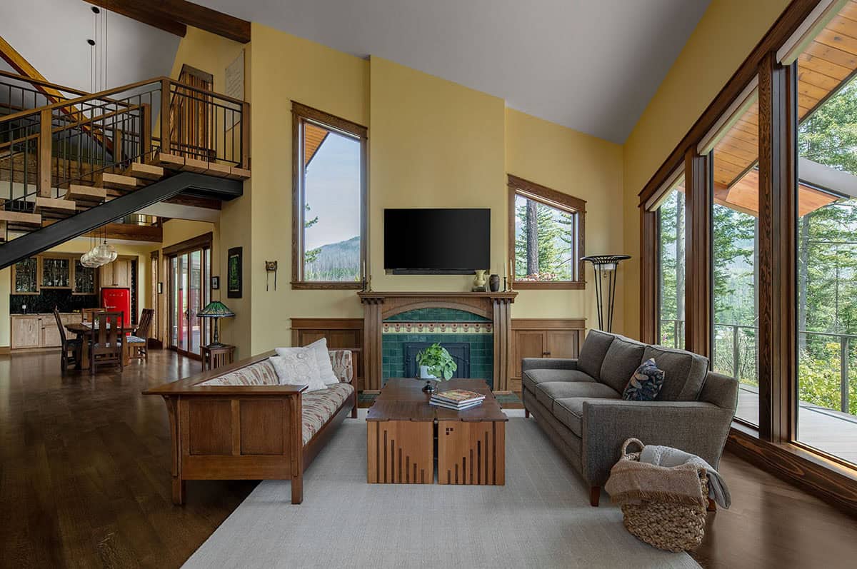 craftsman style open living room with a custom fireplace