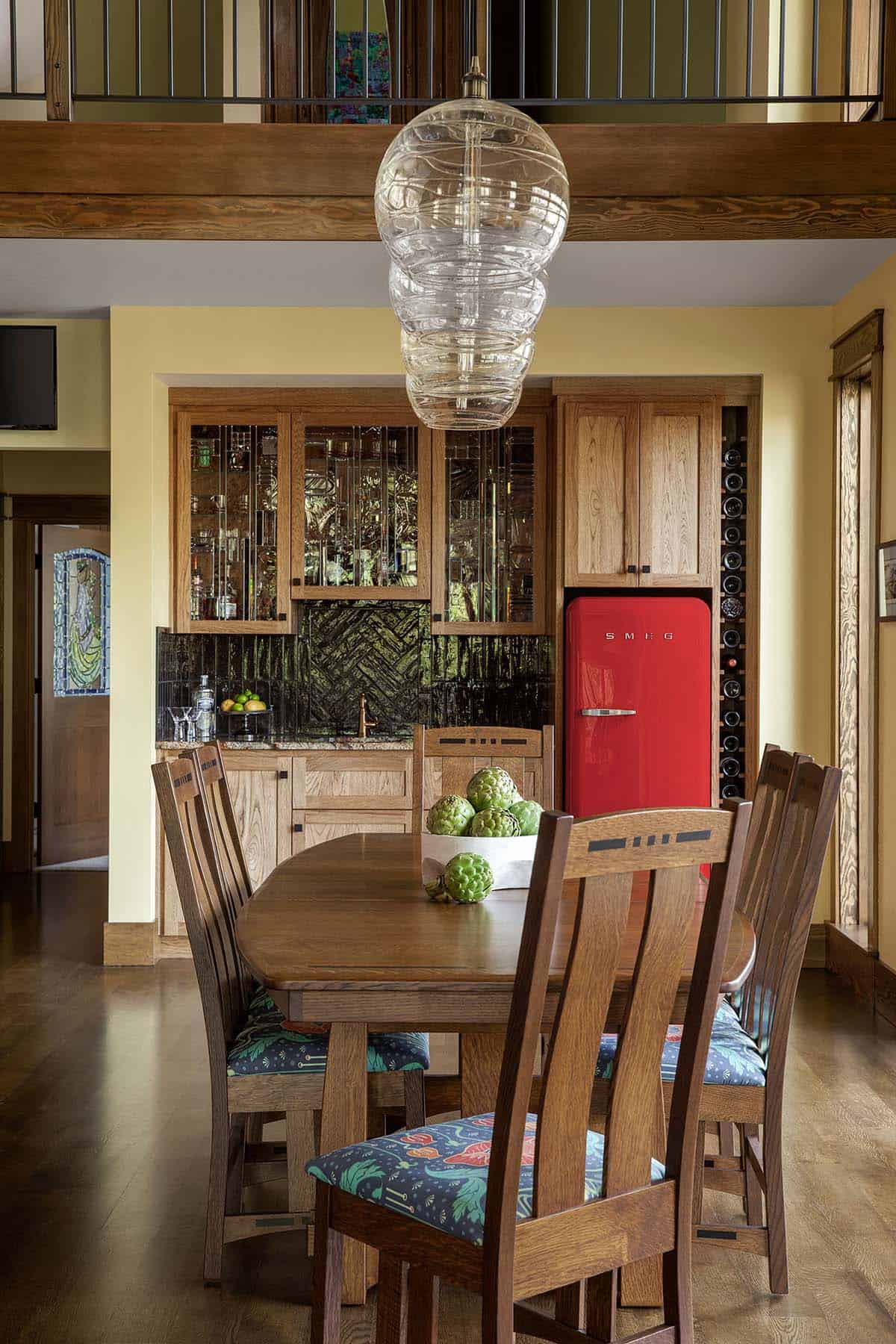 craftsman style open dining room with custom heart hickory cabinetry