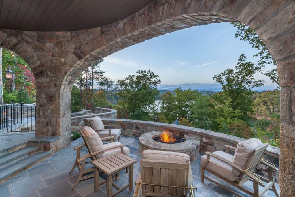 Rustic covered porch with a fire pit