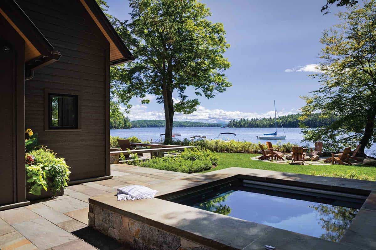 lake house exterior with a hot tub