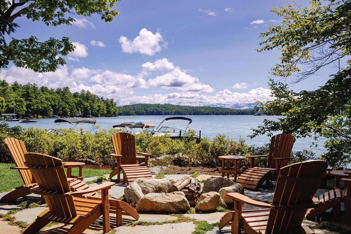 lake house exterior patio with a fire pit