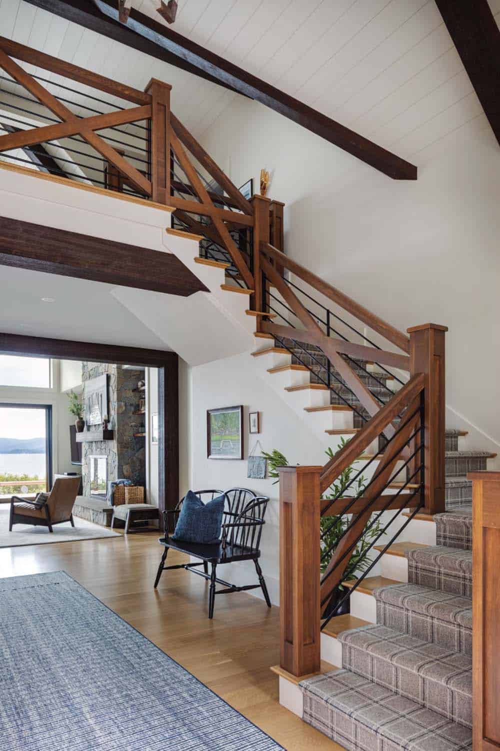 contemporary lake house entry with a staircase