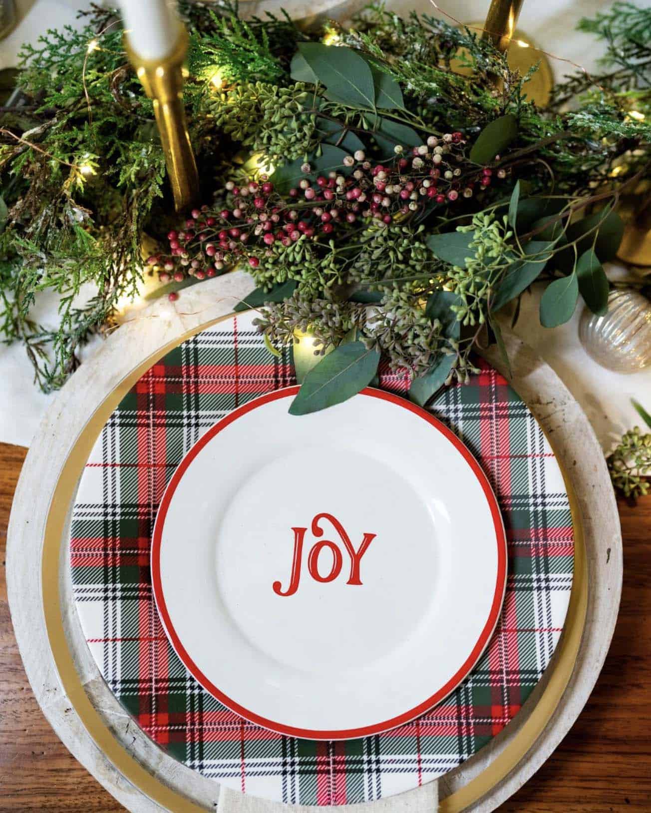 red, white, and green christmas dining table place setting