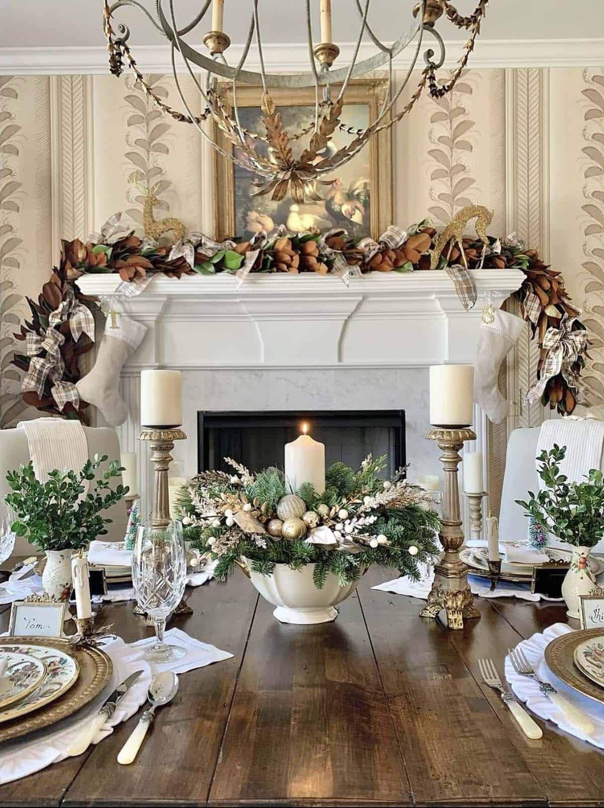 christmas decorated dining room with a fireplace and garland