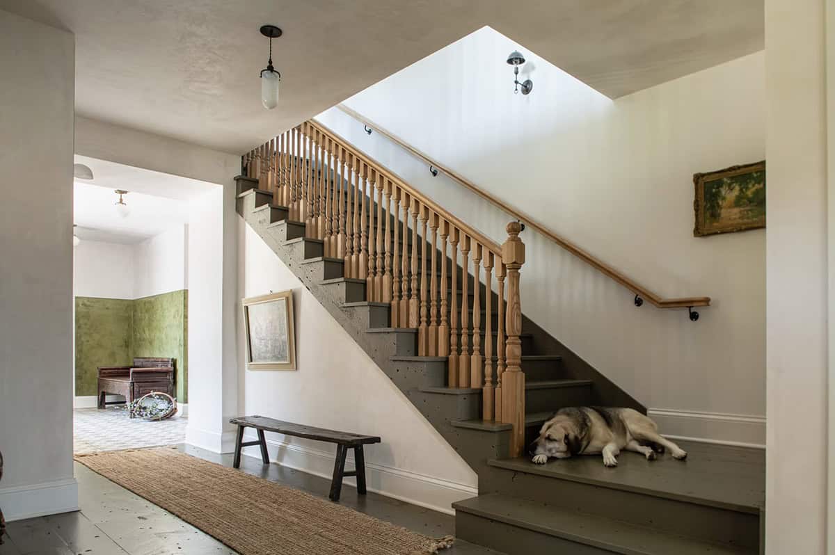 farmhouse entry with a staircase