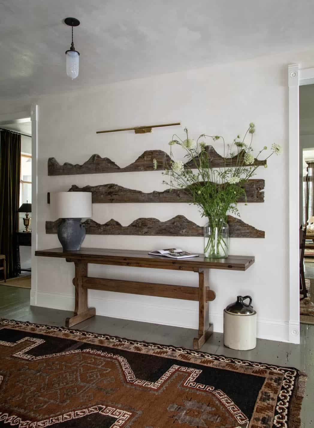 farmhouse entry with a wooden table