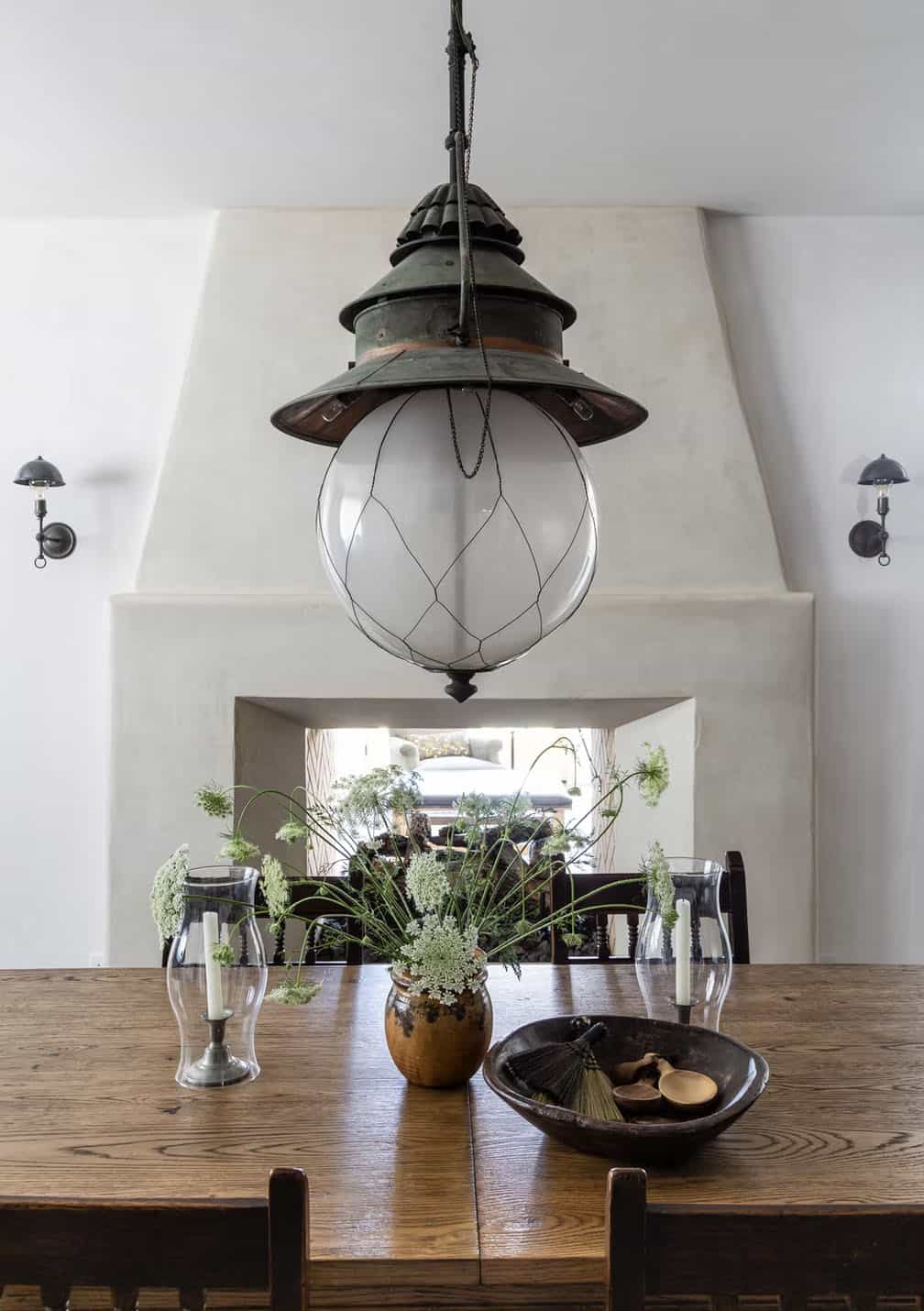 farmhouse dining room with a dual-sided fireplace