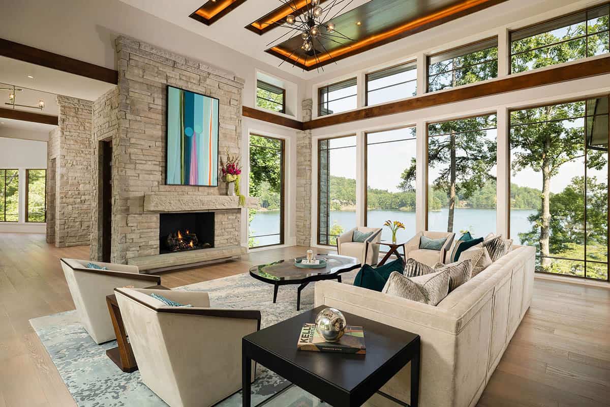 contemporary living room with a fireplace and large windows