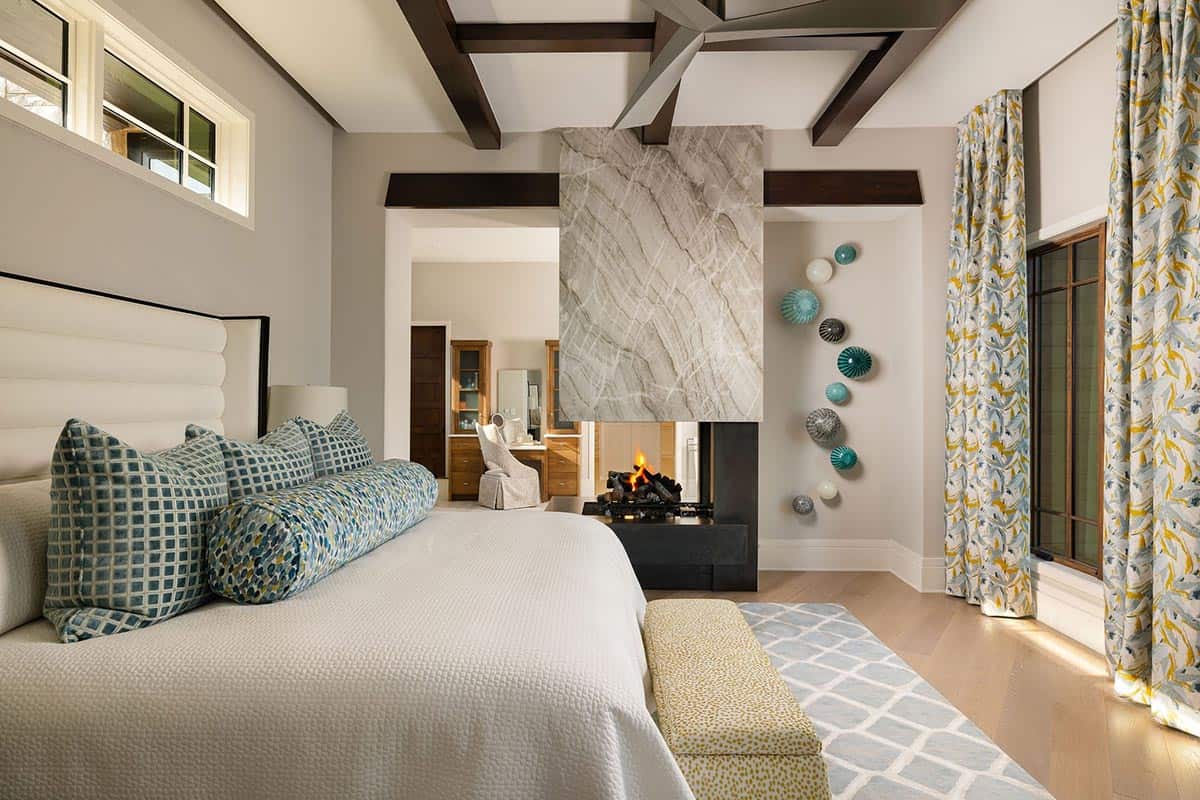 contemporary bedroom with a fireplace