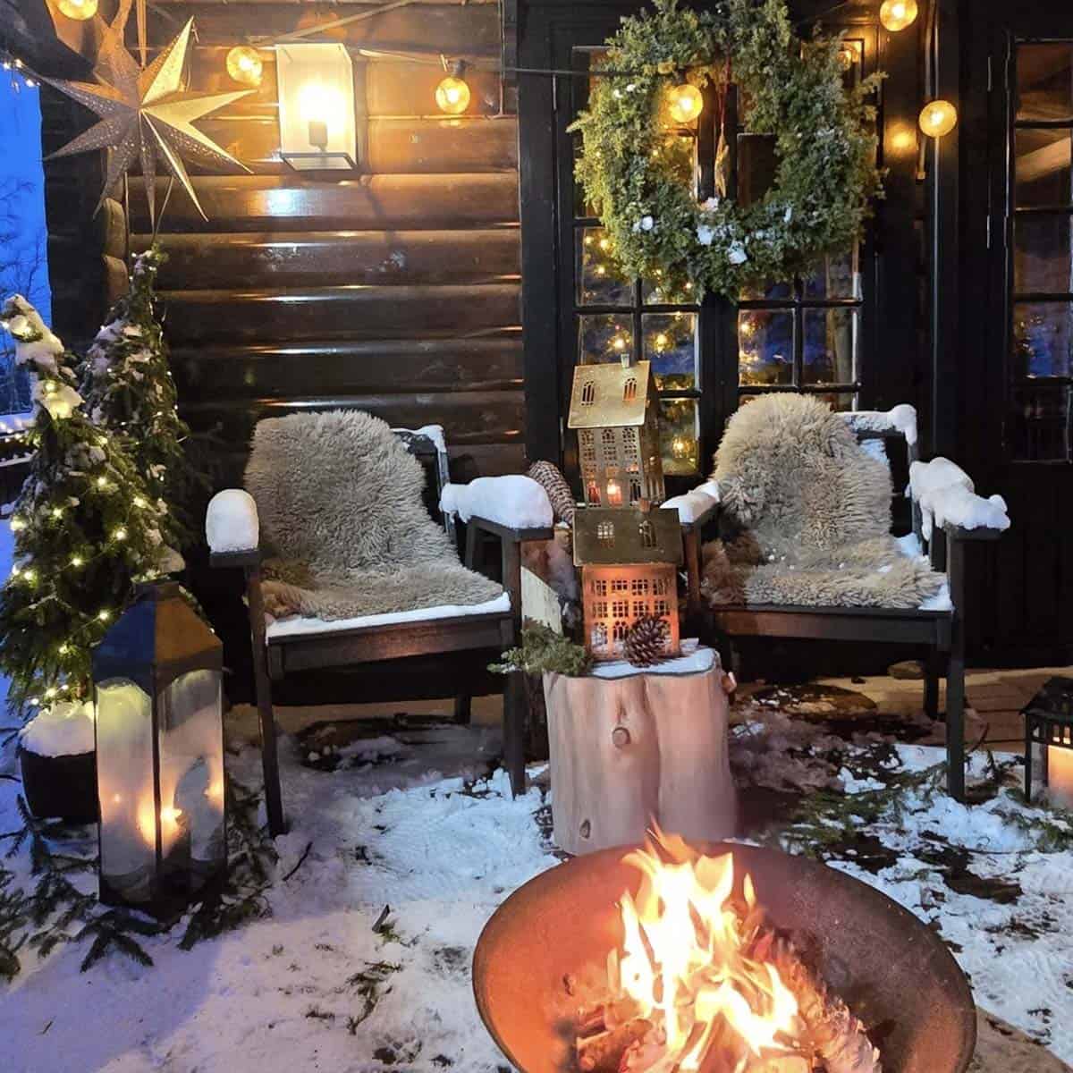 covered patio with a fire pit and christmas decorations
