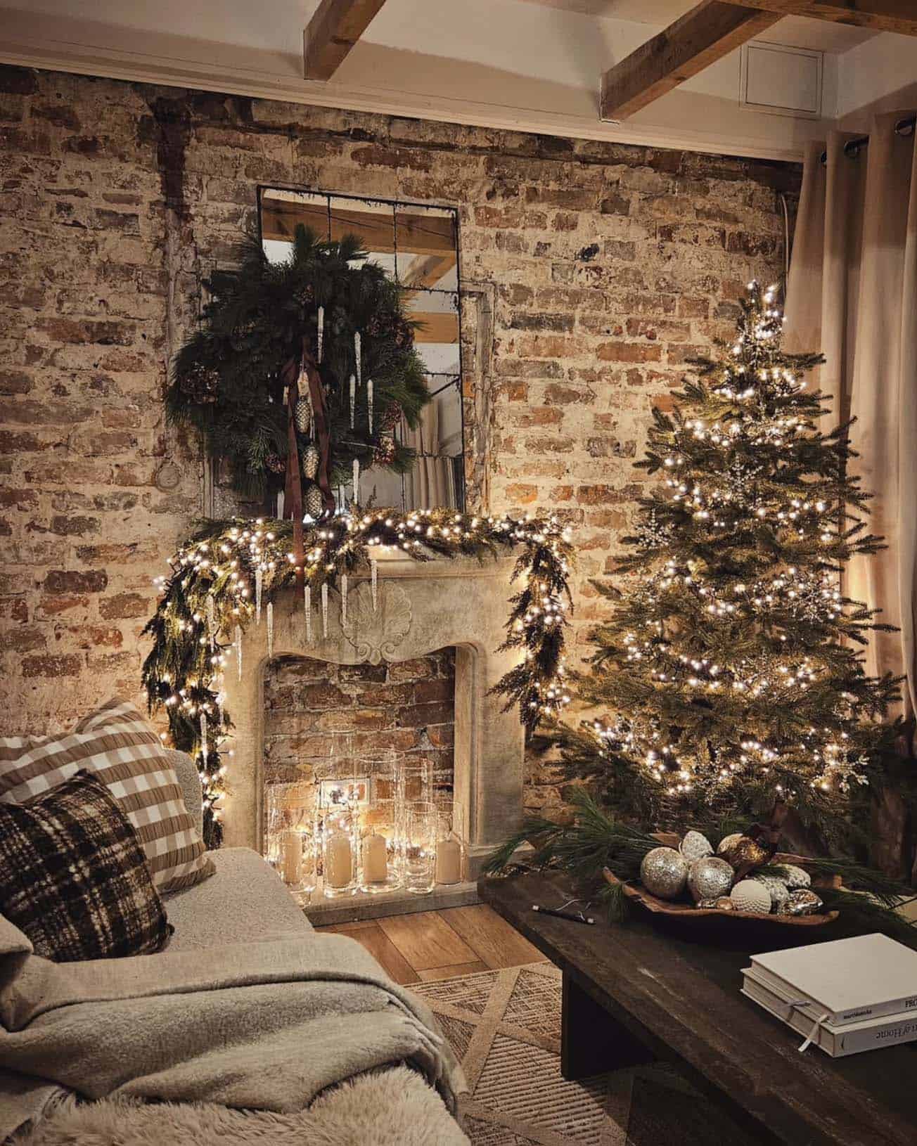 christmas decorated living room with a tree and fireplace