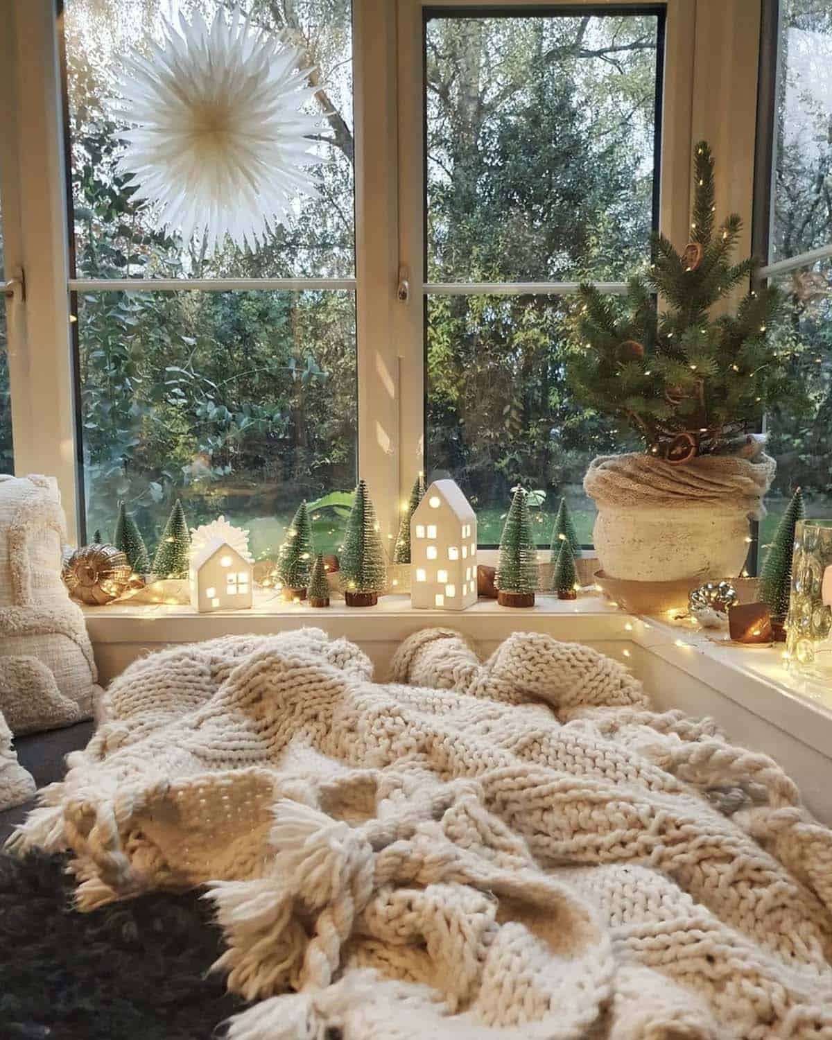 cozy christmas corner with lighted houses and small trees