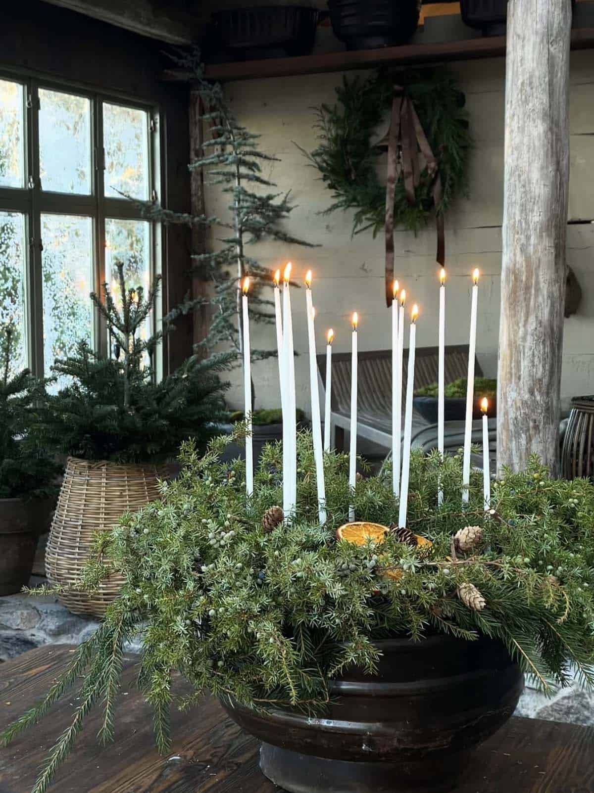 christmas centerpiece with greenery and candles