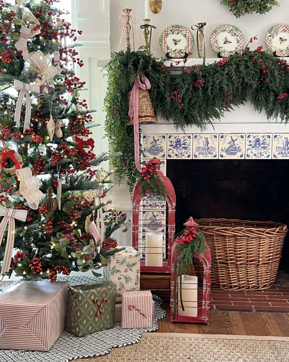 christmas tree and fireplace mantel with garland