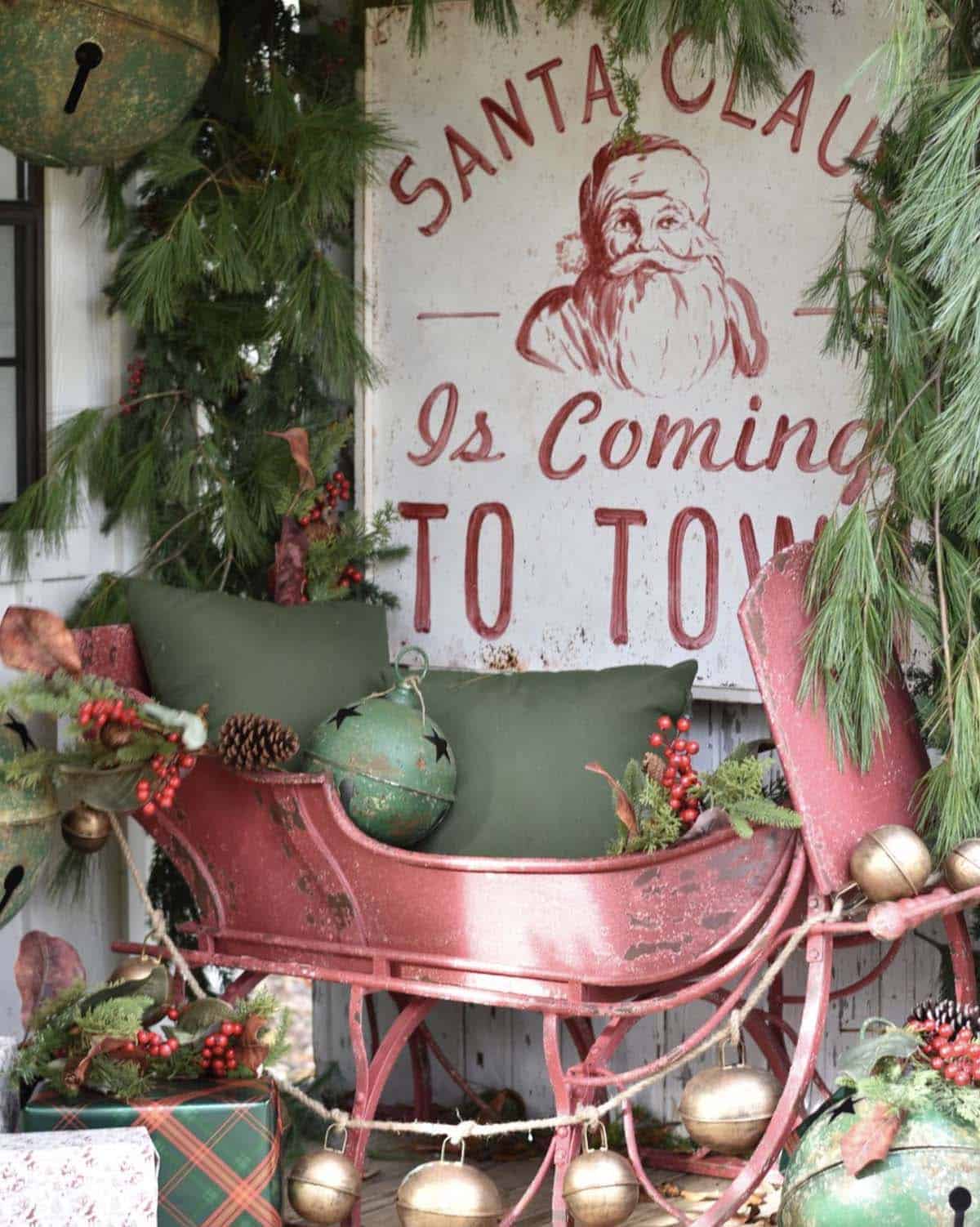 red santa sleigh with a christmas sign