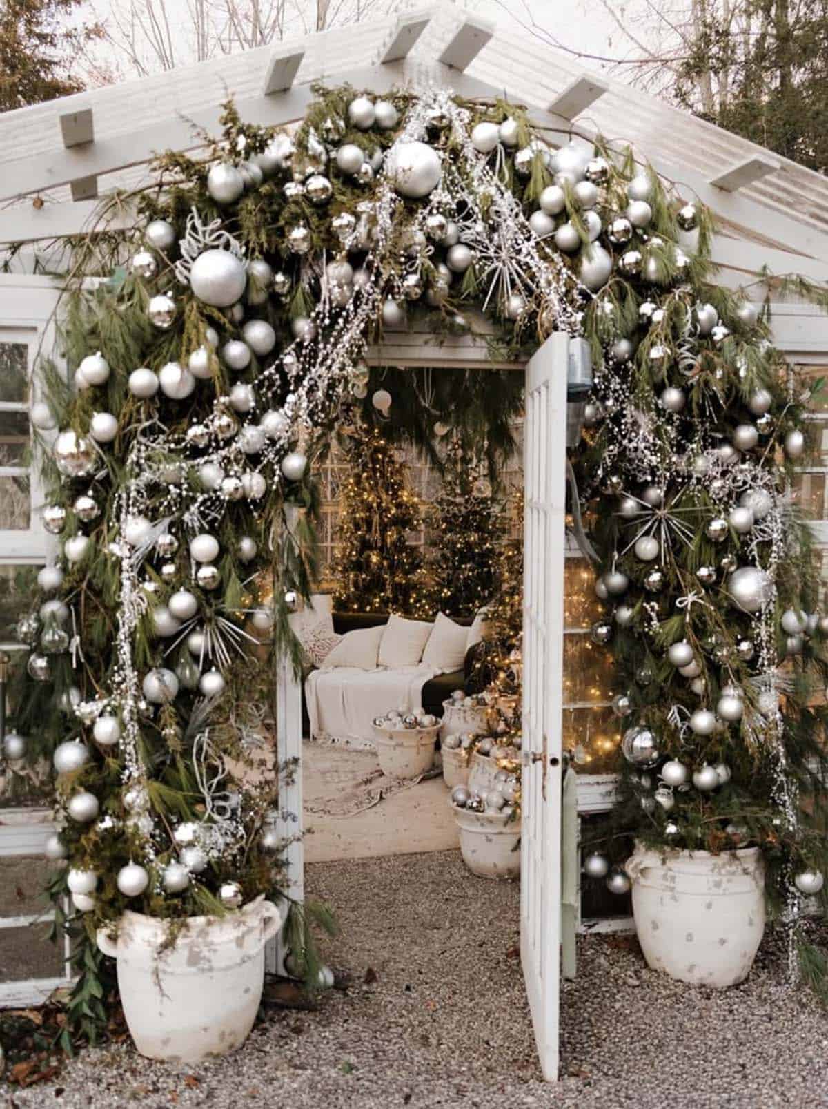 green house with silver ornaments and garland