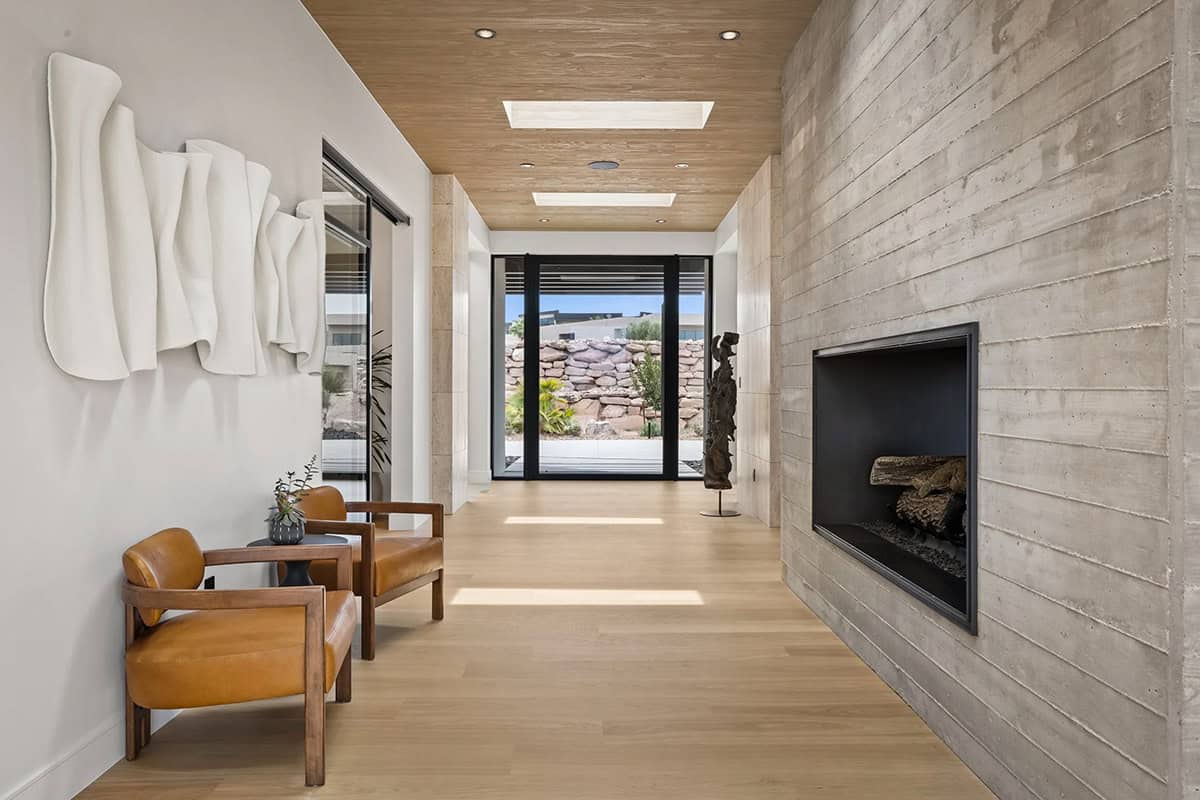 modern desert home entry with a fireplace