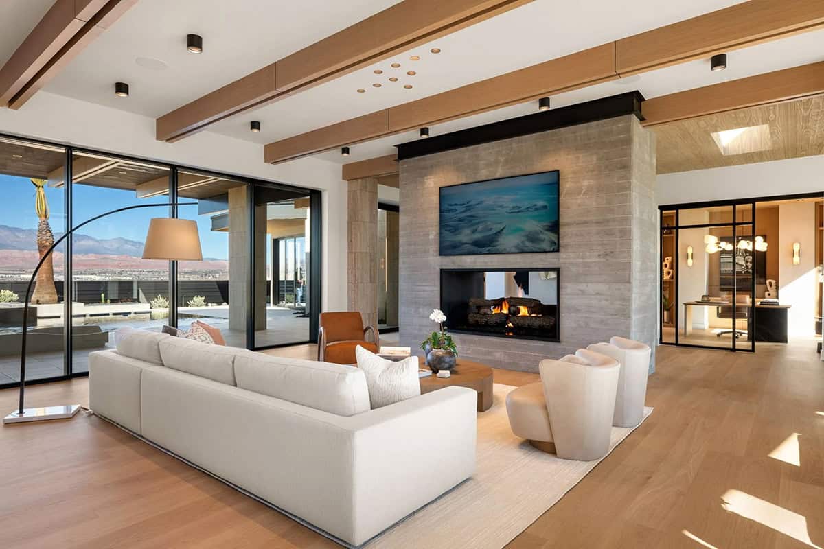 modern living room with a dual-sided fireplace