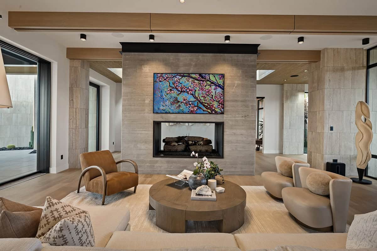 modern living room with a dual-sided fireplace