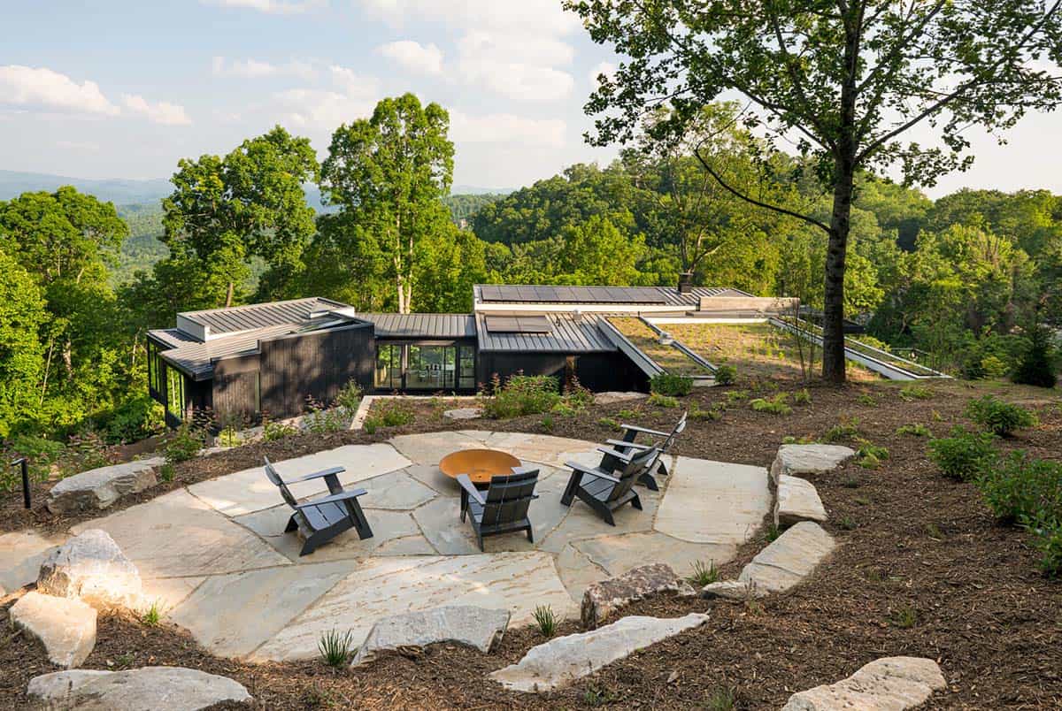 mountain modern home exterior with a patio and outdoor furniture