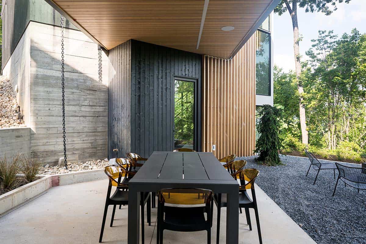 mountain modern home exterior with a covered patio and alfresco dining