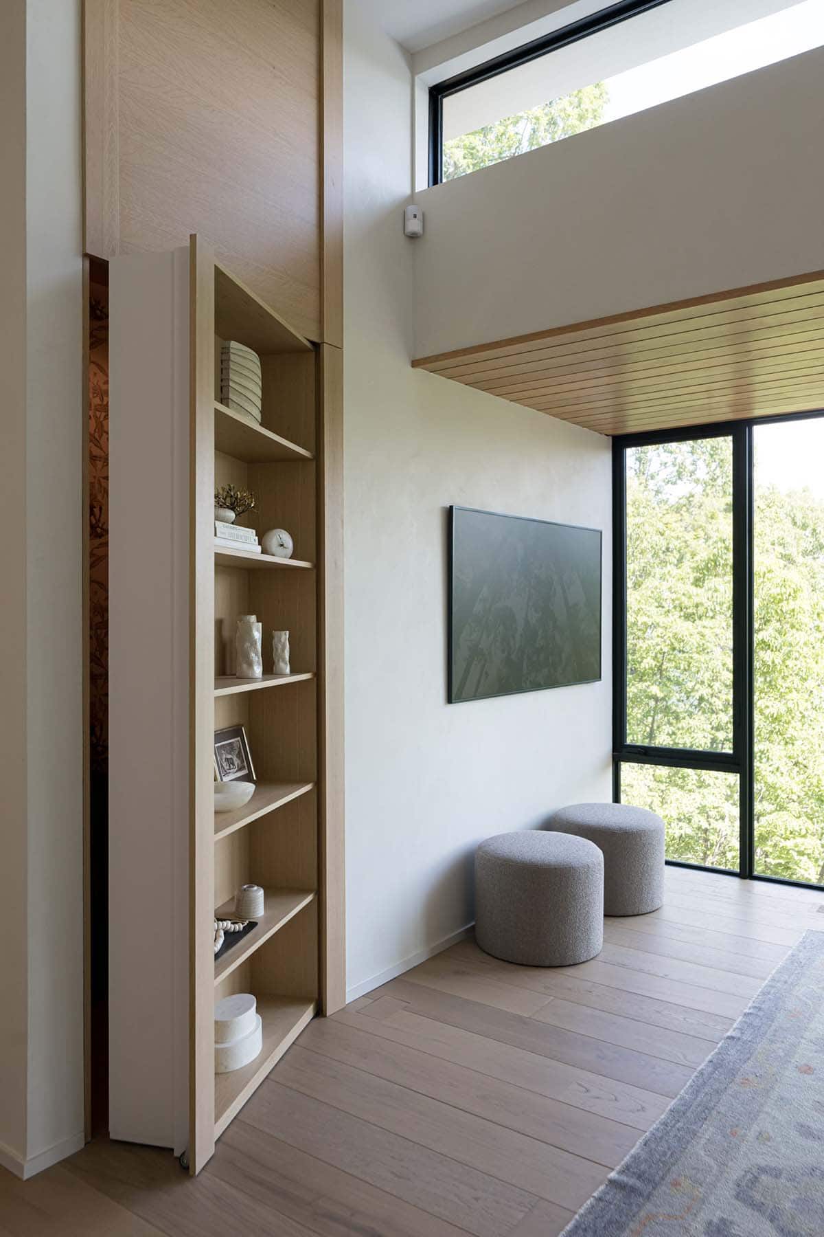 modern living room with a secret bookcase door
