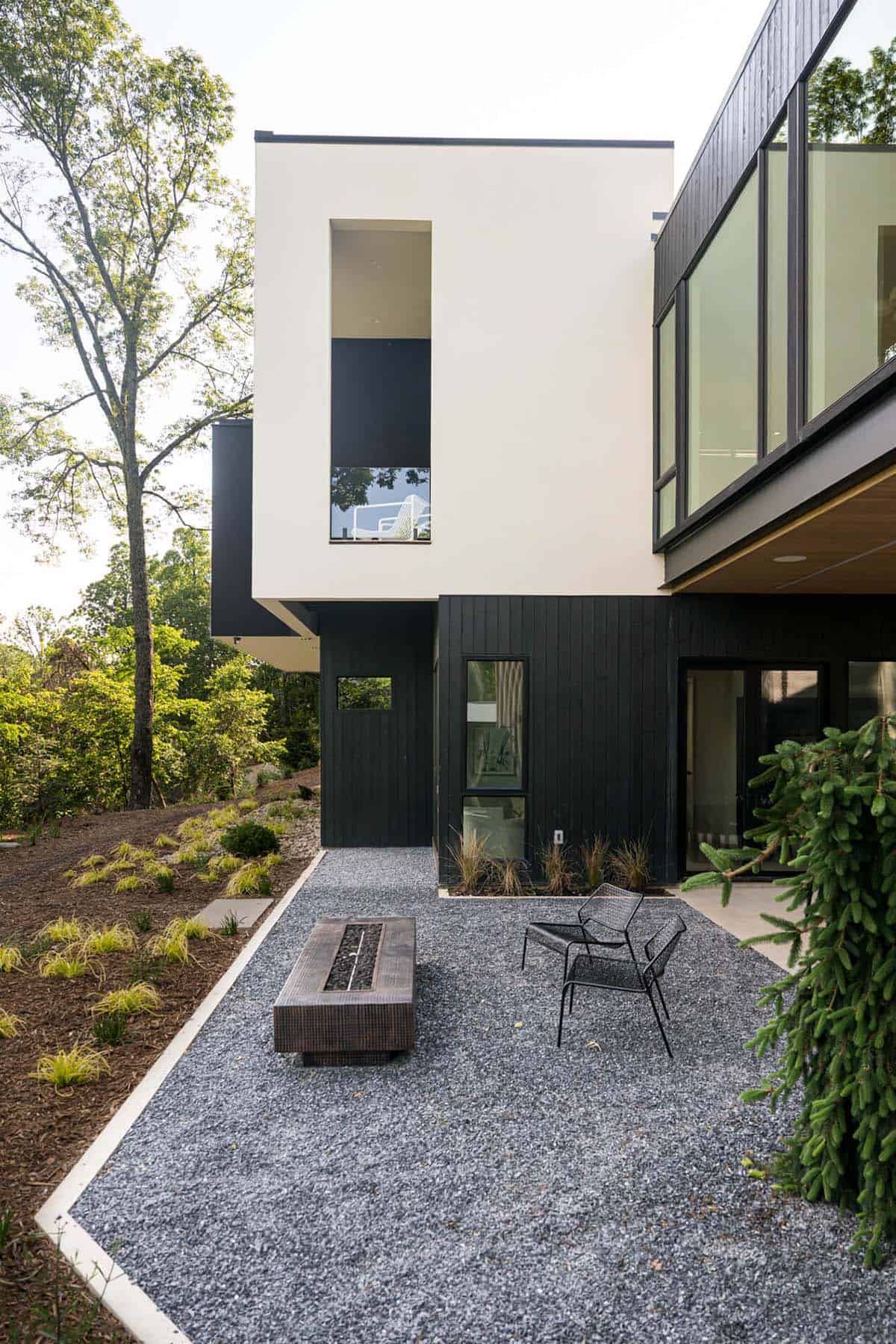 mountain modern home exterior with a patio and fire pit