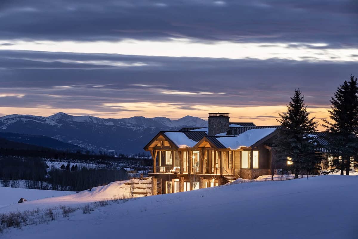 modern mountain home exterior at dusk