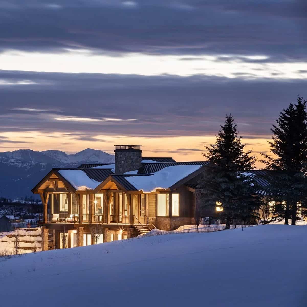 modern mountain home exterior at dusk