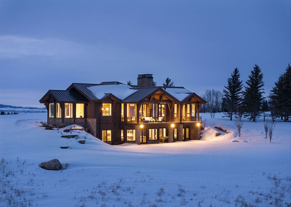 modern mountain home exterior at dusk