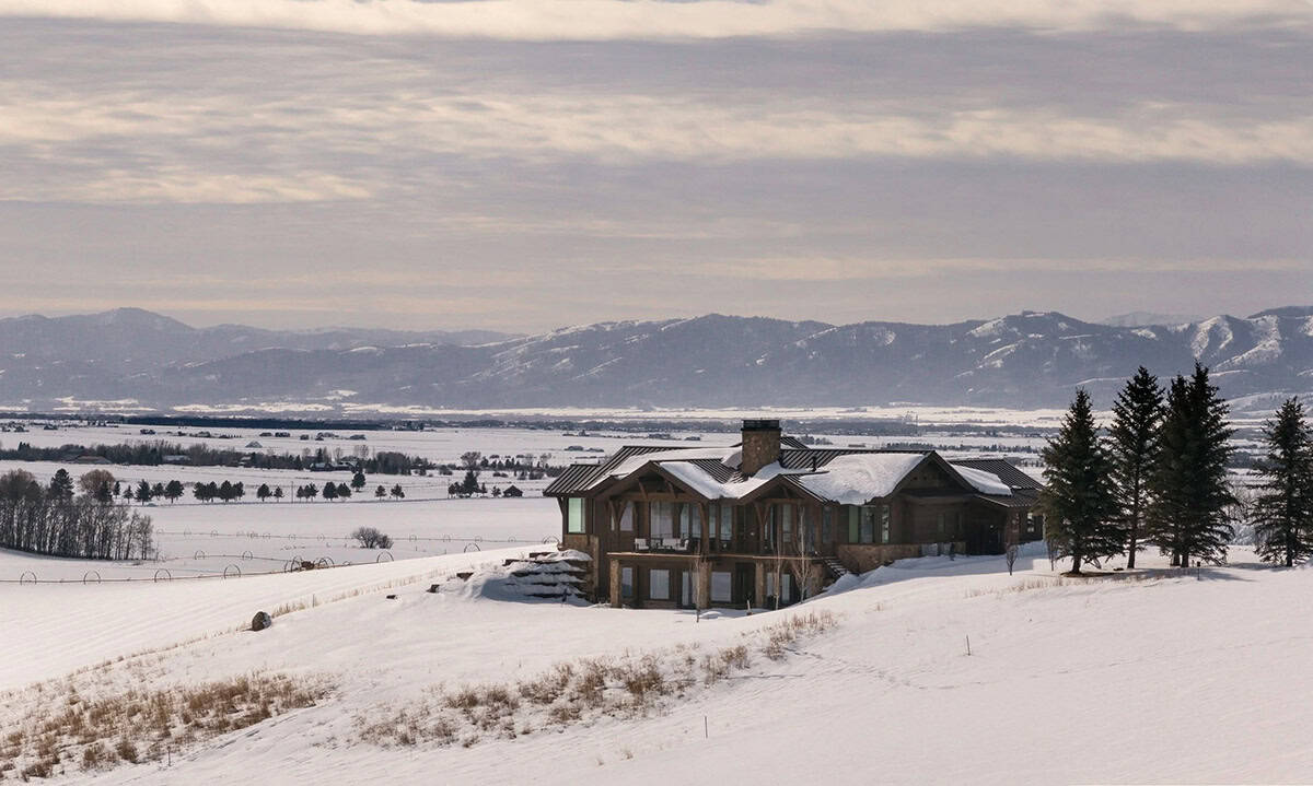 modern mountain home exterior with snow