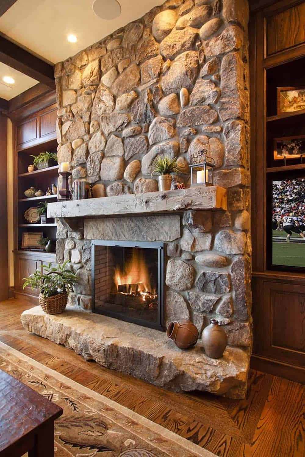 mountain rustic family room with a fireplace