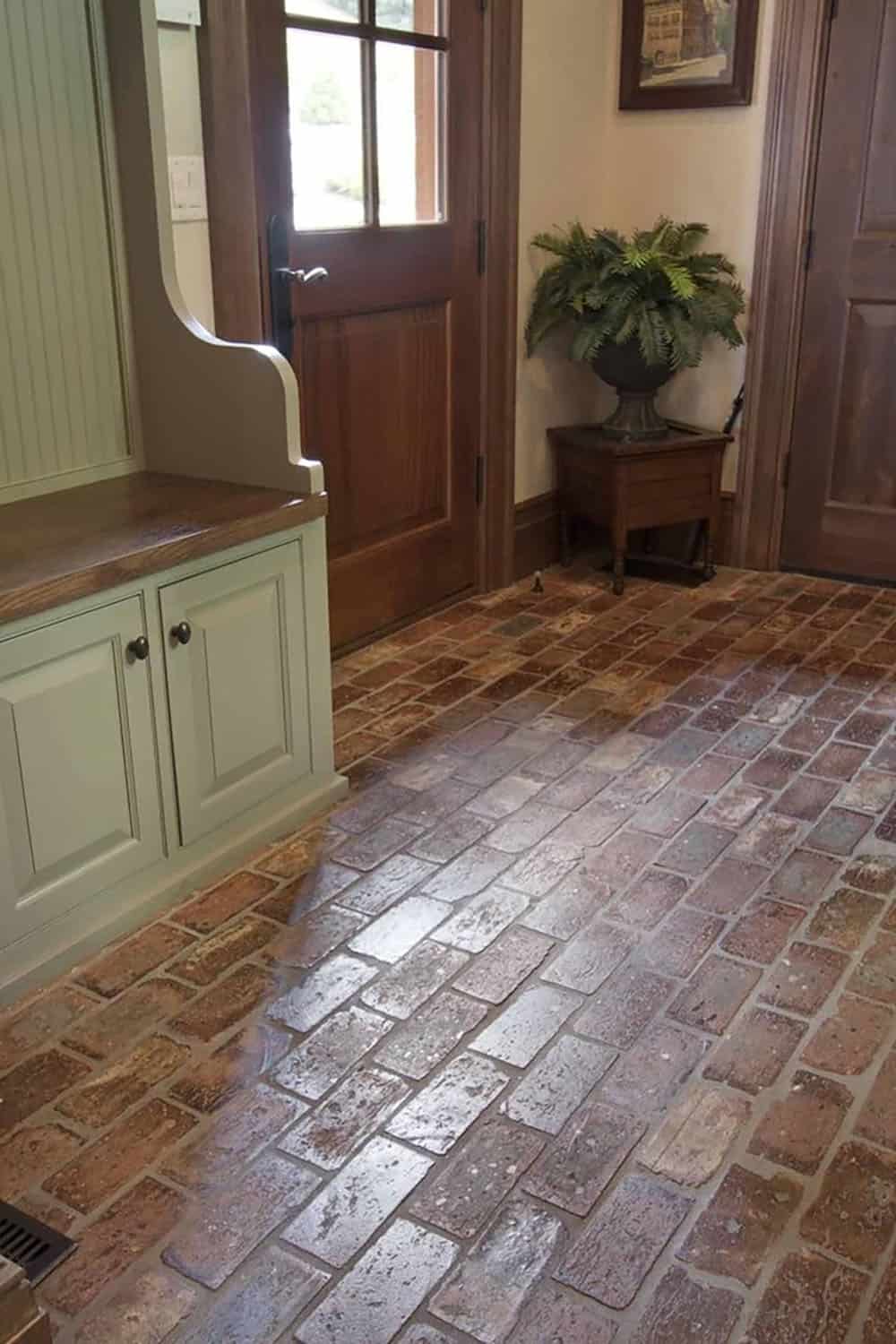 mountain rustic mudroom entry with brick flooring