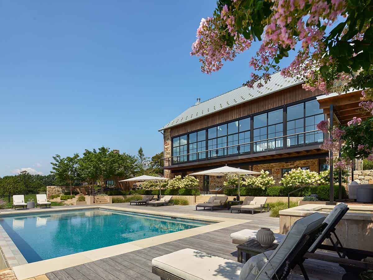 bank barn exterior with a pool
