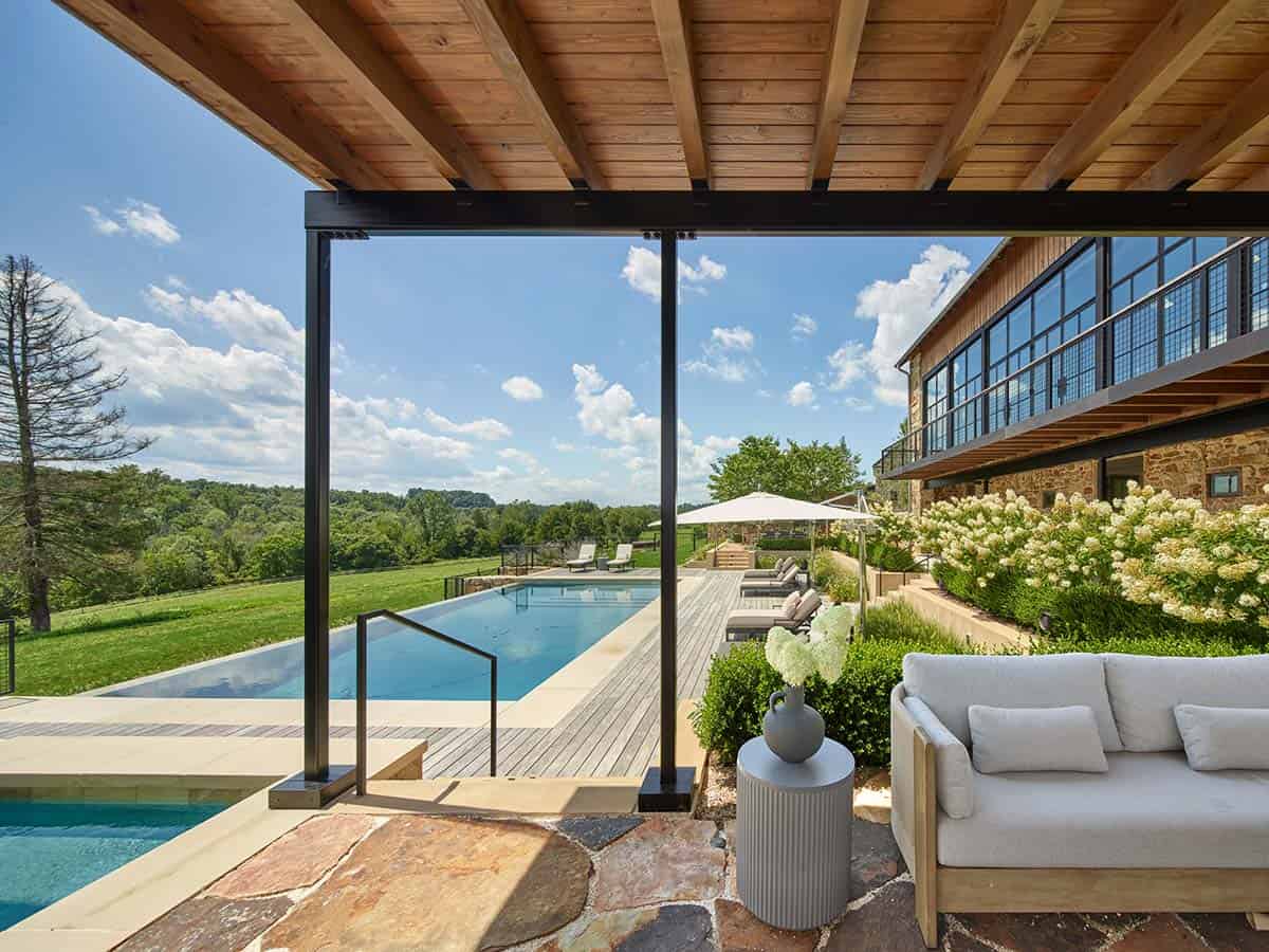 bank barn exterior with a pool